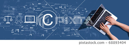 Copyright concept with woman using a laptop Copyright concept with woman using a laptop 68893404