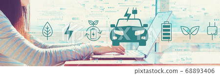 EV concept with woman working on a laptop 68893406