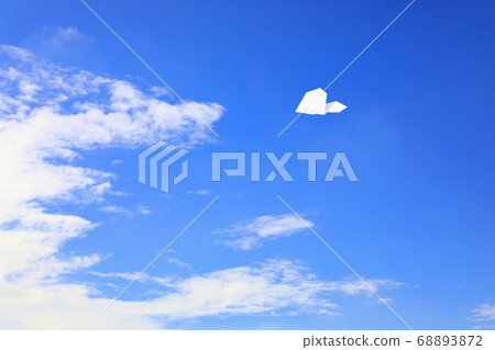 Paper airplane flying in the sky 68893872