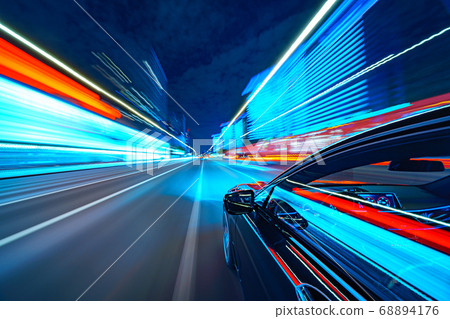 View from Side of Car moving in a night city 68894176