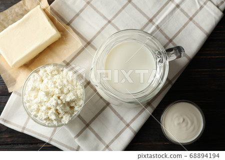 Fresh dairy products and towel on wooden Fresh dairy products and towel on wooden 68894194