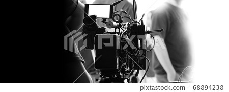 Behind the scenes of video recording or filming online movie by 8K high definition digital camera and professional monitor. And flare lighting set up with film crew team in the studio production. Behind the scenes of video recording or filming online movie by 8K high definition digital camera and professional monitor. And flare lighting set up with film crew team in the studio production. 68894238