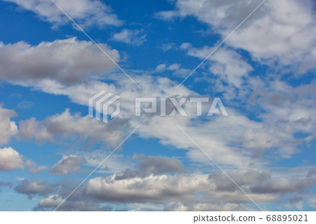 White and gray clouds in the backlight White and gray clouds in the backlight 68895021