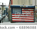 Stars and stripes drawn on the shutter of the parking lot 68896088