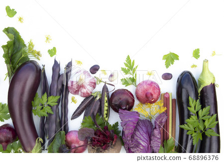 Collection of fresh purple vegetables on a white background with space for text. Banner, poster, advertisement. Collection of fresh purple vegetables on a white background with space for text. Banner, poster, advertisement. 68896376