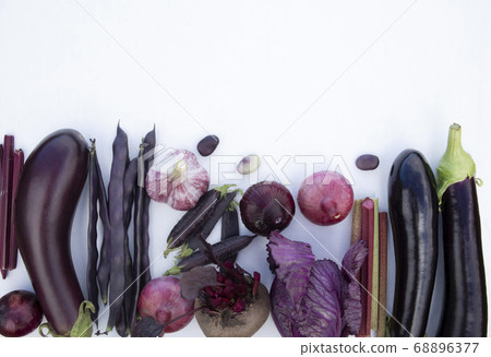 Collection of fresh purple vegetables on a white background with space for text. Banner, poster, advertisement. Collection of fresh purple vegetables on a white background with space for text. Banner, poster, advertisement. 68896377