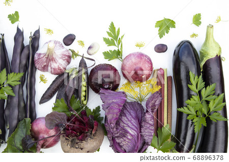 Collection of fresh purple vegetables on a white background with space for text. Banner, poster, advertisement. Collection of fresh purple vegetables on a white background with space for text. Banner, poster, advertisement. 68896378