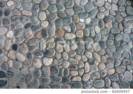 masonry wall paving stones as a background close up 68899947