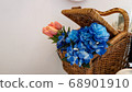 Blue and yellow flowers in a picnic bag 68901910