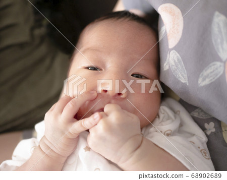 Cute baby on the 11th day of life Cute baby on the 11th day of life 68902689