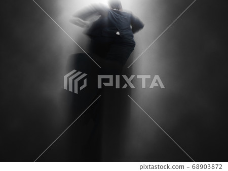 Businessman wandering in the dark aiming for the goal Businessman wandering in the dark aiming for the goal 68903872