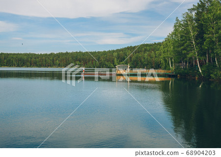 fishing bridge by the river. boat landing on the lake. water and transport 68904203