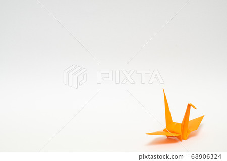 Orange paper crane on a white background 68906324