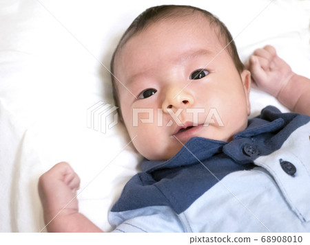 Happy 1 month old newborn baby 68908010