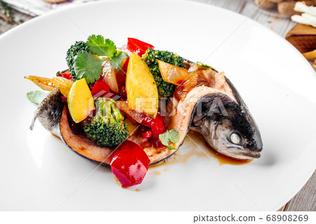 Gourmet sea bass fish filled with vegetables Gourmet sea bass fish filled with vegetables 68908269