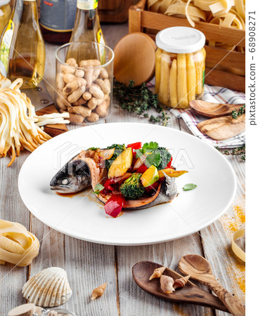 Gourmet sea bass fish filled with vegetables Gourmet sea bass fish filled with vegetables 68908271