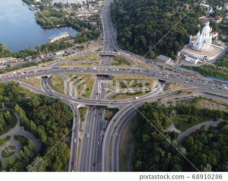 Cars ride on the road. Kyiv. Ukraine. Aerial Cars ride on the road. Kyiv. Ukraine. Aerial 68910286