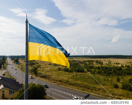 National flag of Ukraine by day. Kyiv aerial 68910540