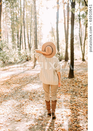 autumn yellow leaf fall conceptual girl park 68910641