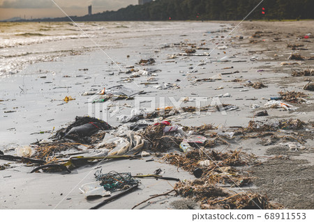 Dirty waste plastic garbage on the beach. 68911553