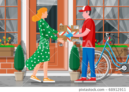 Woman receive cardboard box from man. 68912911