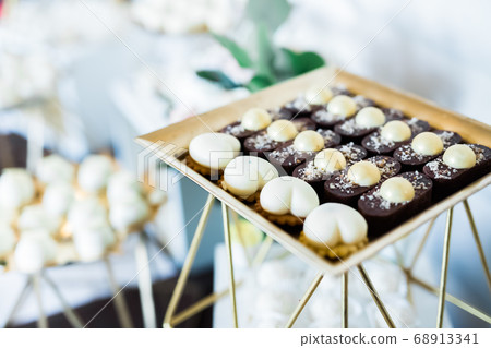 Delicious wedding reception candy bar dessert table 68913341