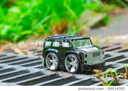 A car running on a rough road A car running on a rough road 68914365
