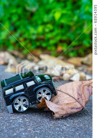 A car running on a rough road 68914395