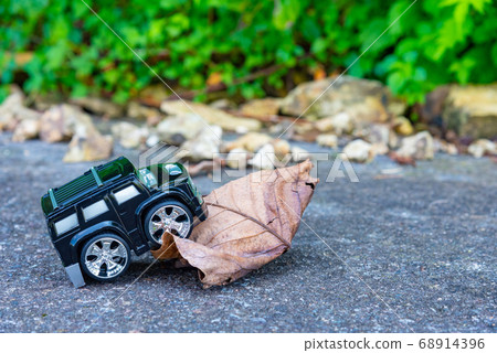 A car running on a rough road 68914396