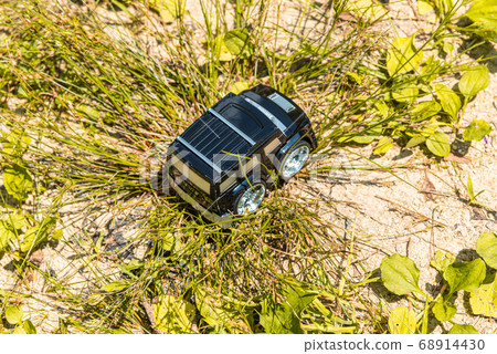 A car running on a rough road 68914430