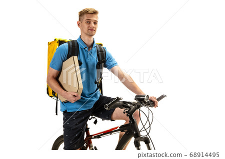 Deliveryman isolated on white studio background. Contacless delivery service during quarantine. Deliveryman isolated on white studio background. Contacless delivery service during quarantine. 68914495