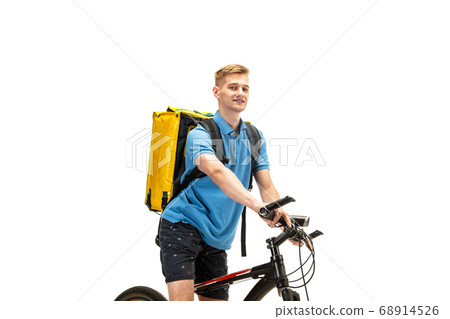 Deliveryman isolated on white studio background. Contacless delivery service during quarantine. Deliveryman isolated on white studio background. Contacless delivery service during quarantine. 68914526