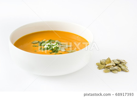 Pumpkin soup in bowl isolated on white background Pumpkin soup in bowl isolated on white background 68917393