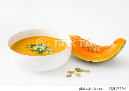 Pumpkin soup in bowl isolated on white background Pumpkin soup in bowl isolated on white background 68917394