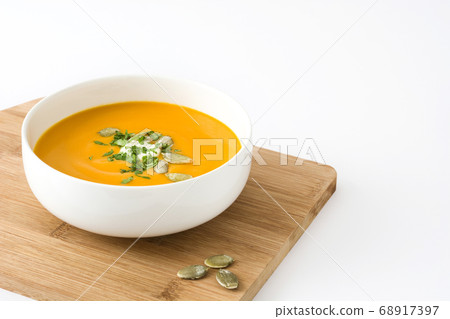 Pumpkin soup in bowl isolated on white background Pumpkin soup in bowl isolated on white background 68917397