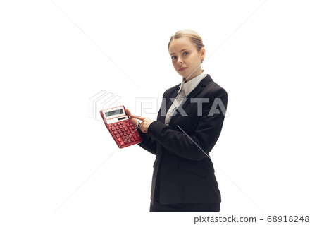 Young woman, accountant, booker in office suit isolated on white studio background Young woman, accountant, booker in office suit isolated on white studio background 68918248