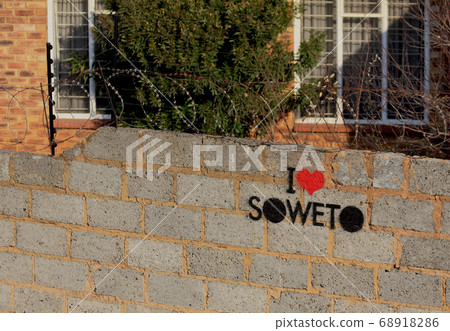 Fence with barbed wire and the inscription   68918286