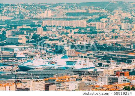 Marseille, France. Elevated View Of Cityscape. Port Terminal, Residential Districts And Streets Under Sunny Summer Sky Marseille, France. Elevated View Of Cityscape. Port Terminal, Residential Districts And Streets Under Sunny Summer Sky 68919254