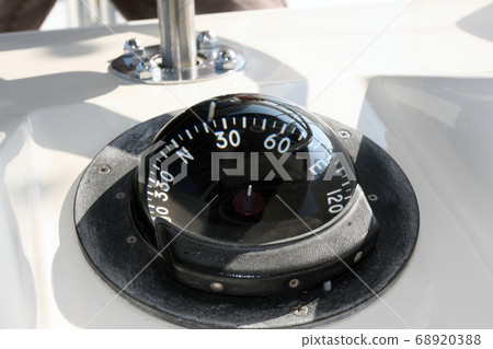 Compass on a sea fishing boat. Gyrocompass on the ship Compass on a sea fishing boat. Gyrocompass on the ship 68920388