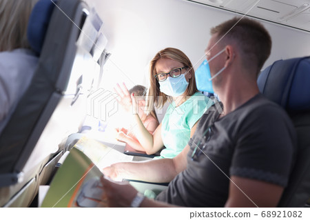 Happy family tete on airplane sitting on diy on vacation portrait 68921082