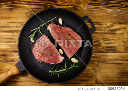 Raw pork steaks ready for preparation 68922054