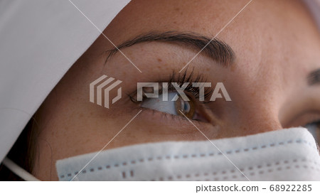 Close up of doctor wearing mask during the Coronavirus pandemic. 68922285