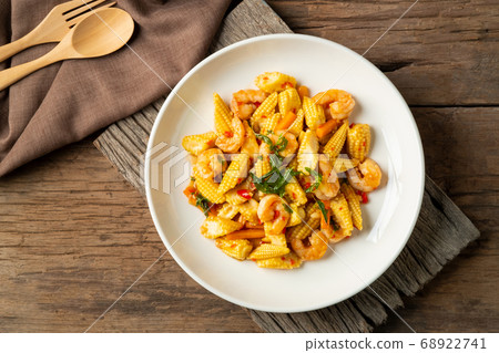 Stir fried young corn with shrimps and basil. 68922741