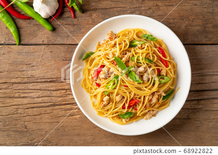 stir fried spicy spaghetti with minced chicken and basil 68922822