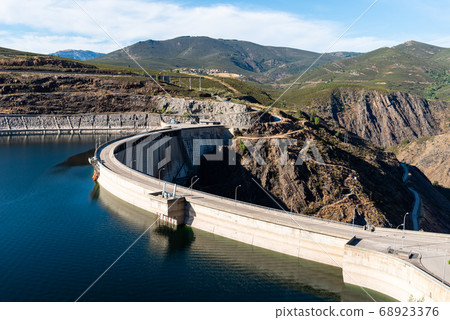 The Atazar reservoir and dam in the mountain range of Madrid The Atazar reservoir and dam in the mountain range of Madrid 68923376