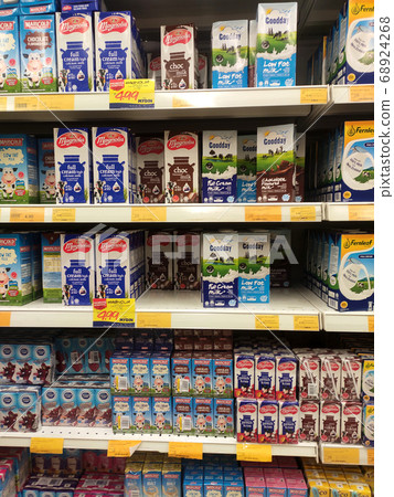 SEREMBAN, MALAYSIA -JULY 5, 2019: Processed and fresh milk packed in the paper box and displayed on the rack inside the supermarkets. Sorted by brand and type for easy for the customer to choose. SEREMBAN, MALAYSIA -JULY 5, 2019: Processed and fresh milk packed in the paper box and displayed on the rack inside the supermarkets. Sorted by brand and type for easy for the customer to choose. 68924268