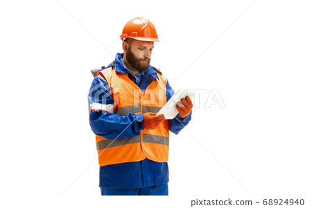 Handsome contractor, builder isolated over white studio background Handsome contractor, builder isolated over white studio background 68924940