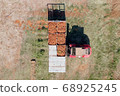 Forklift loading pallets of fresh picked Carrots onto a trailer 68925245