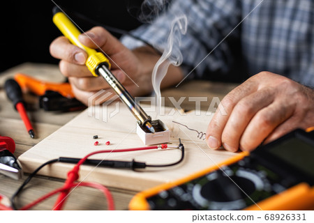 Electrician technician at work. Electronics. Electrician technician at work. Electronics. 68926331