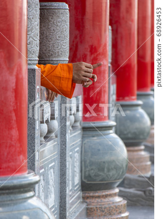 Row of columns in a Buddhist temple with the hands Row of columns in a Buddhist temple with the hands 68926453